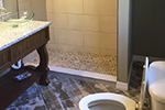 Tile to ceiling, granite countertop, vessel sink, elongated toilet