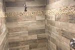 Custom tiled master shower with rainfall